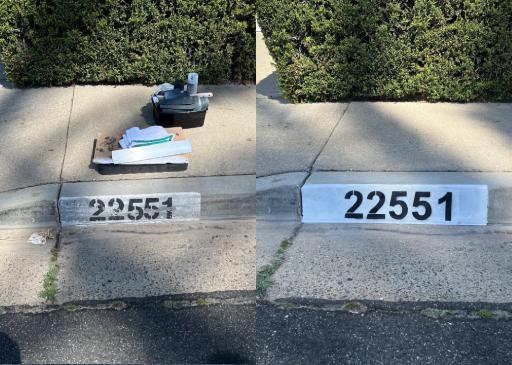 Freshly painted curb address number