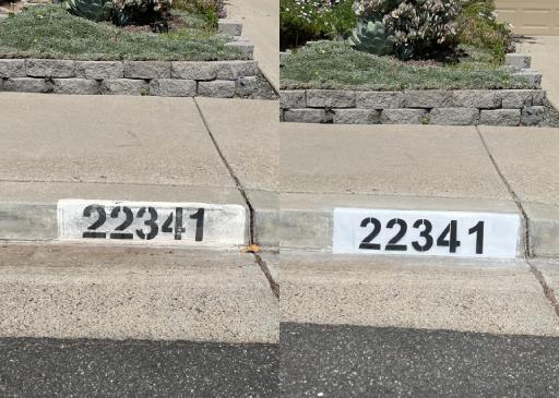 Painted curb numbers on residential street